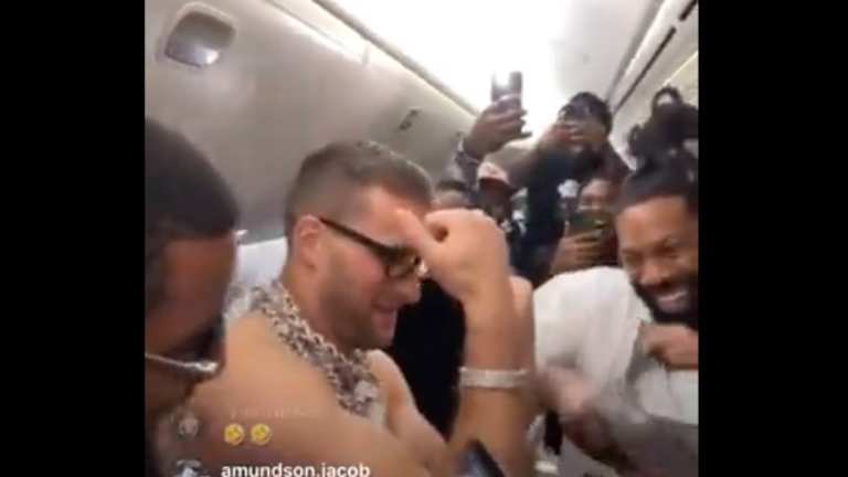 Topless, victorious Kirk Cousins rocks diamond chains again